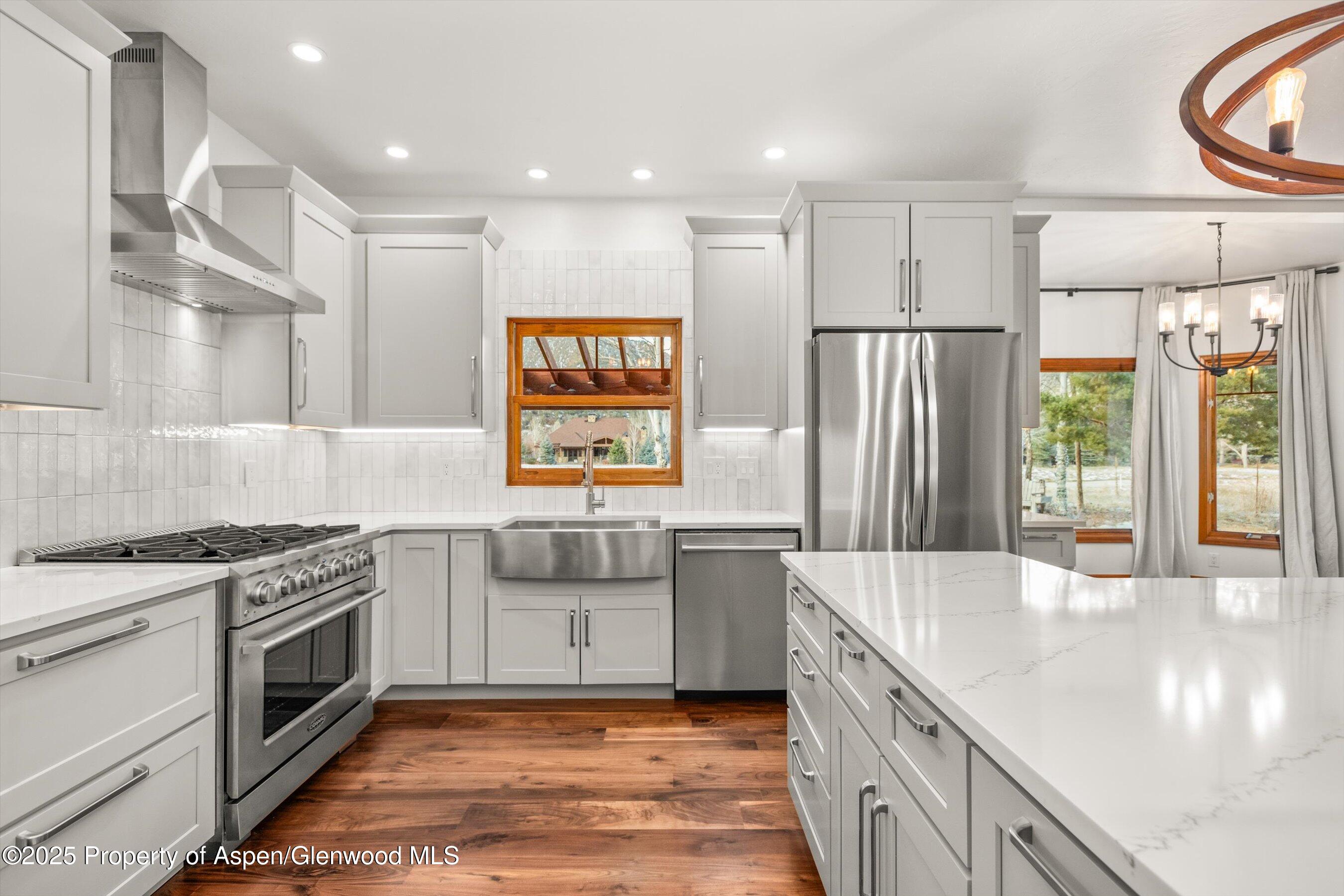75 Buffalo Lane Carbondale, CO 81623 - Photo 15 of 49 a kitchen with stainless steel appliances granite countertop a sink stove and refrigerator