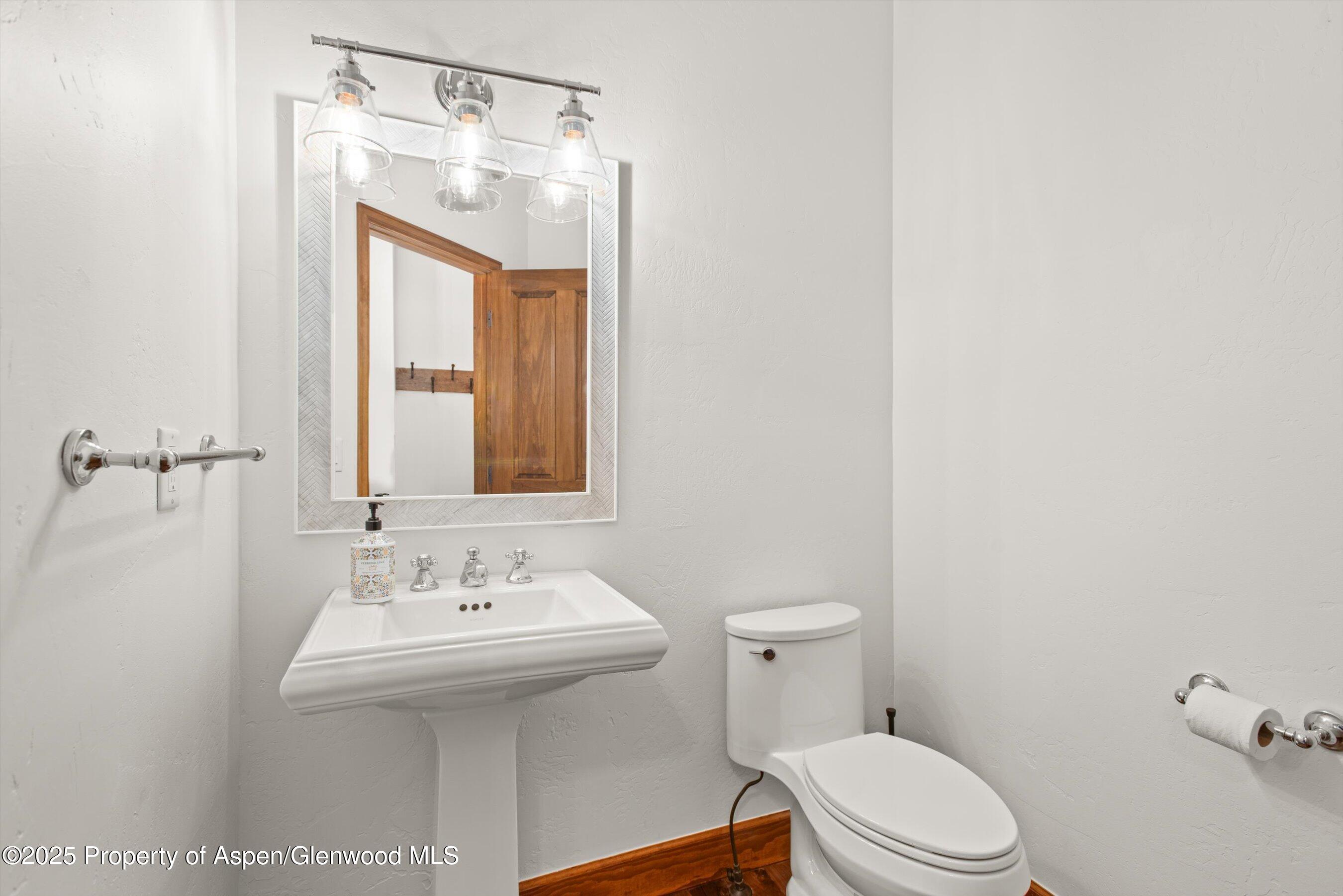 75 Buffalo Lane Carbondale, CO 81623 - Photo 16 of 49 a bathroom with a sink a toilet and mirror
