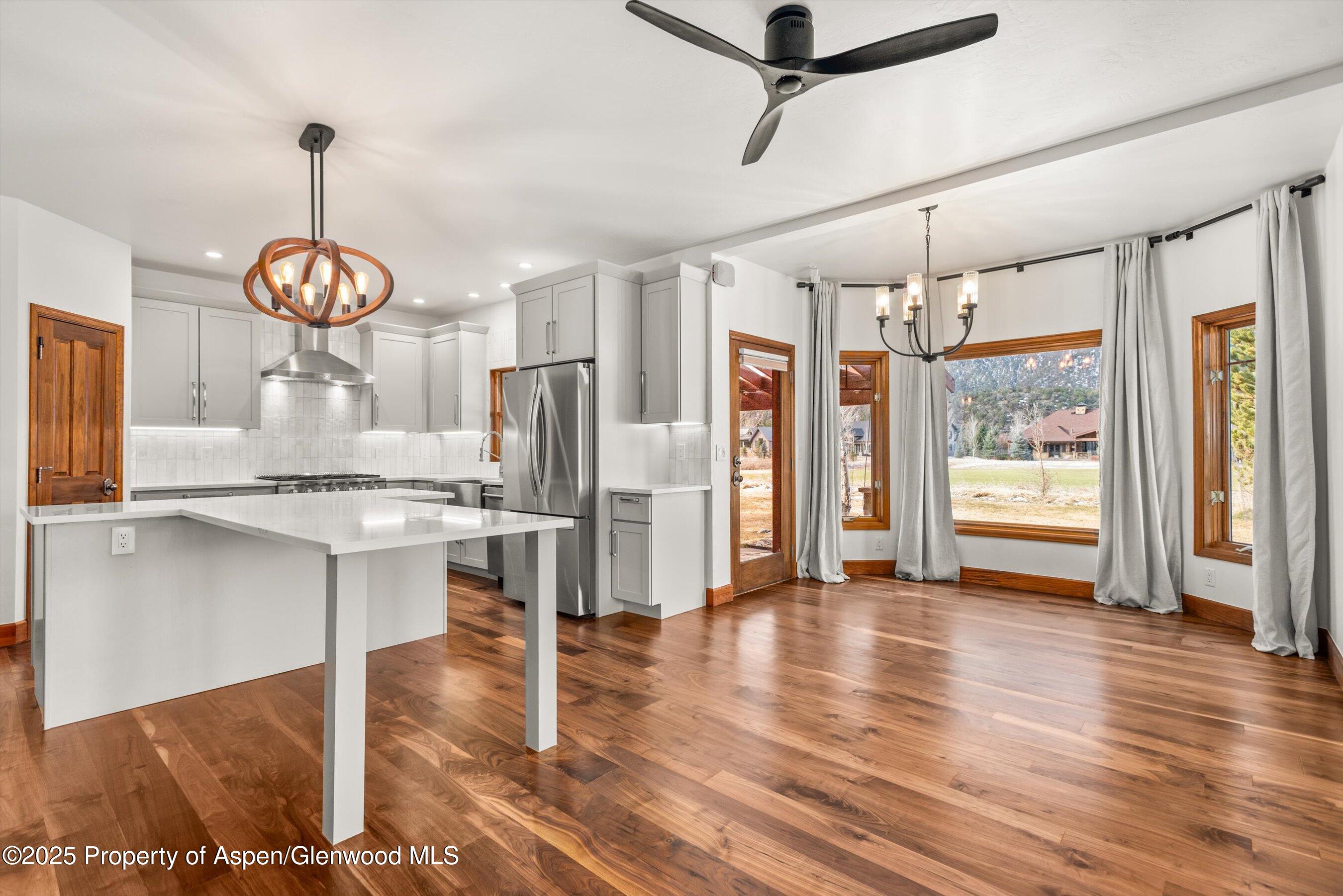 75 Buffalo Lane Carbondale, CO 81623 - Photo 2 of 49 a view of kitchen with stainless steel appliances granite countertop a stove refrigerator and wooden floor