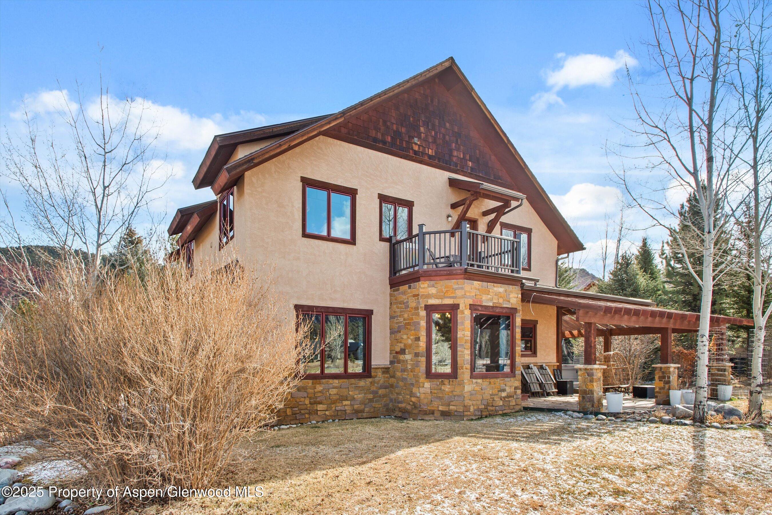 75 Buffalo Lane Carbondale, CO 81623 - Photo 21 of 49 a view of a white house with large windows