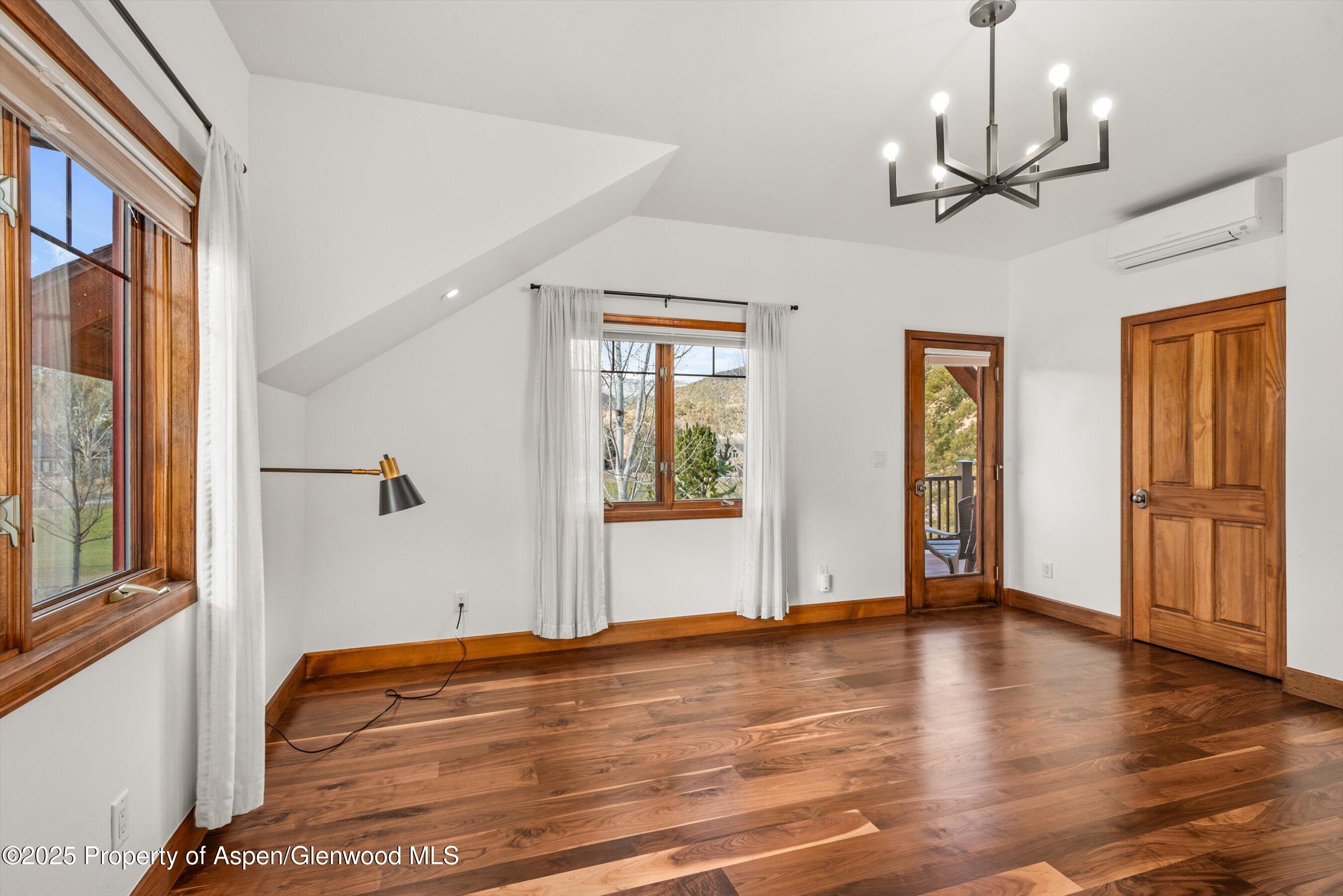 75 Buffalo Lane Carbondale, CO 81623 - Photo 27 of 49 a view of empty room with wooden floor and fan