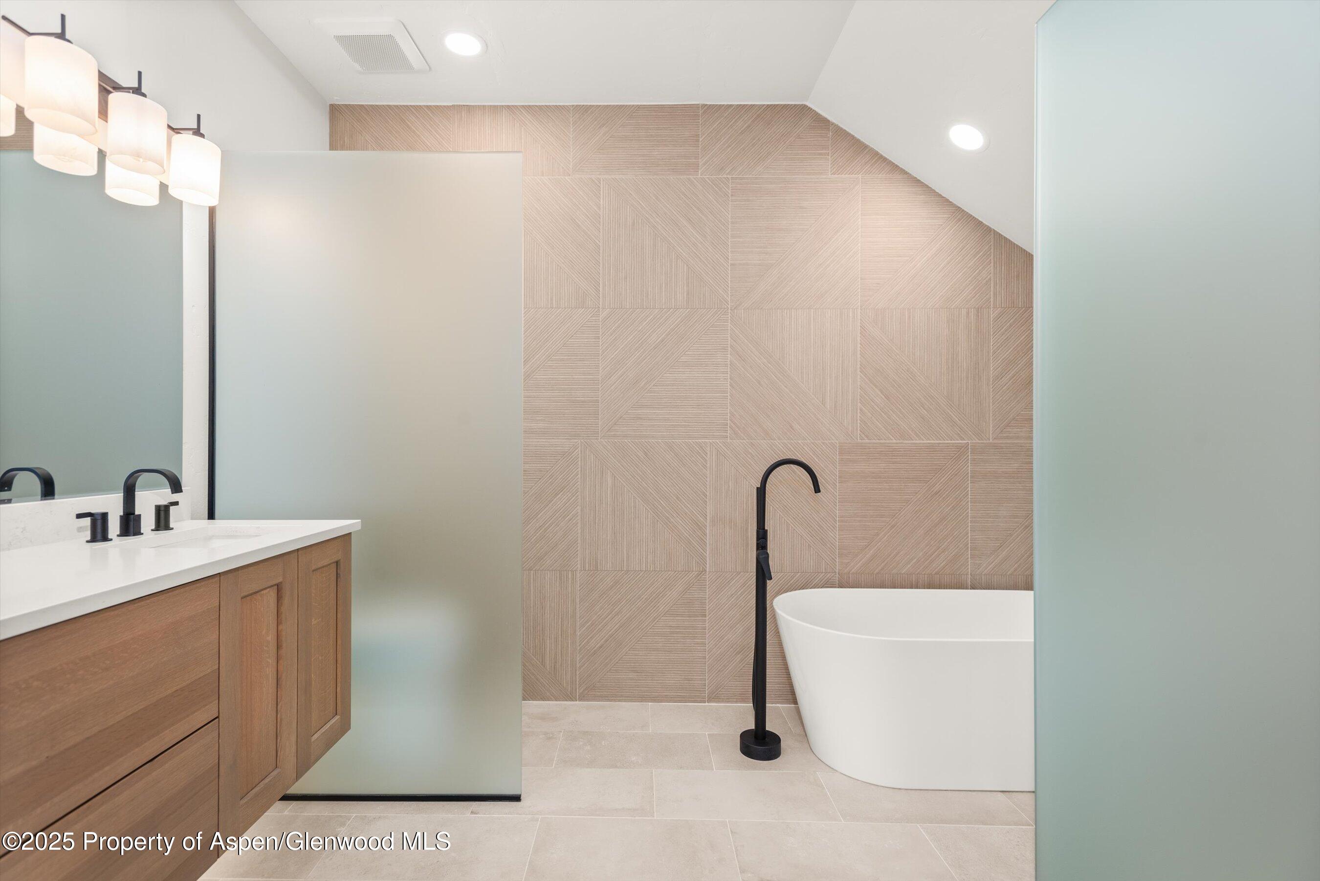 75 Buffalo Lane Carbondale, CO 81623 - Photo 30 of 49 a bathroom with a sink a toilet and mirror