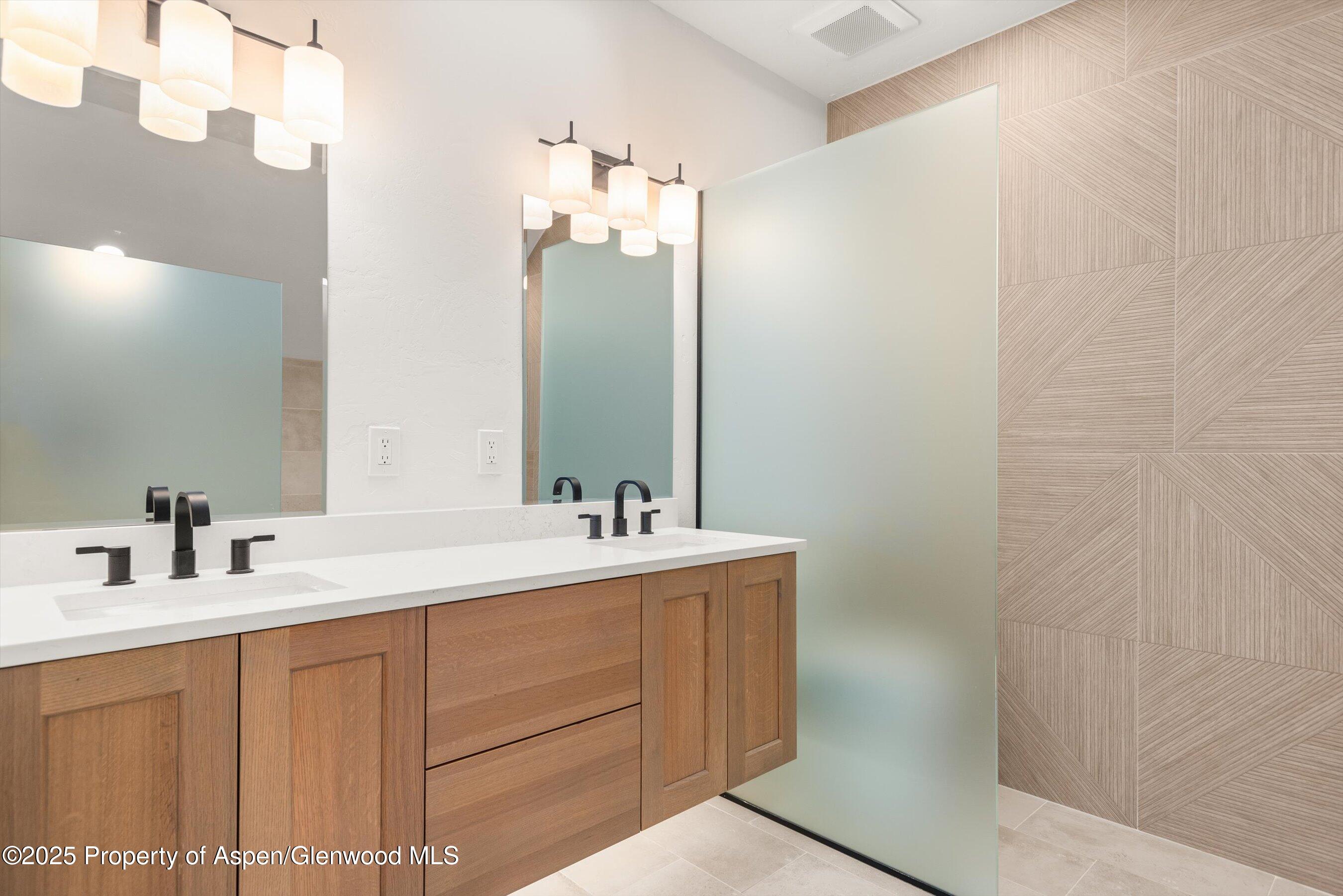 75 Buffalo Lane Carbondale, CO 81623 - Photo 31 of 49 a bathroom with a sink vanity and mirror