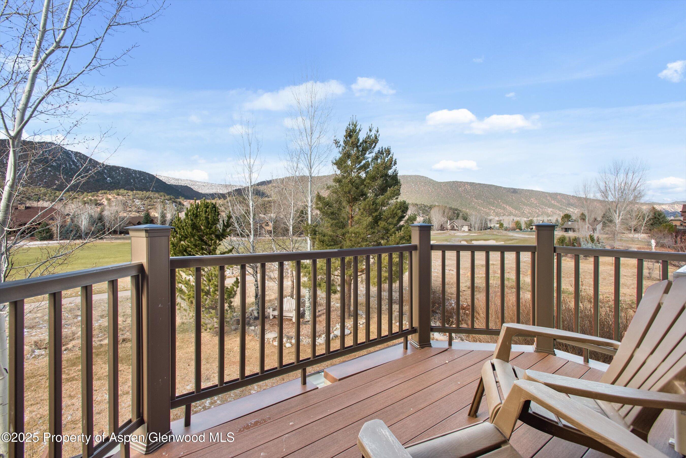 75 Buffalo Lane Carbondale, CO 81623 - Photo 33 of 49 a balcony with wooden floor bench and trees