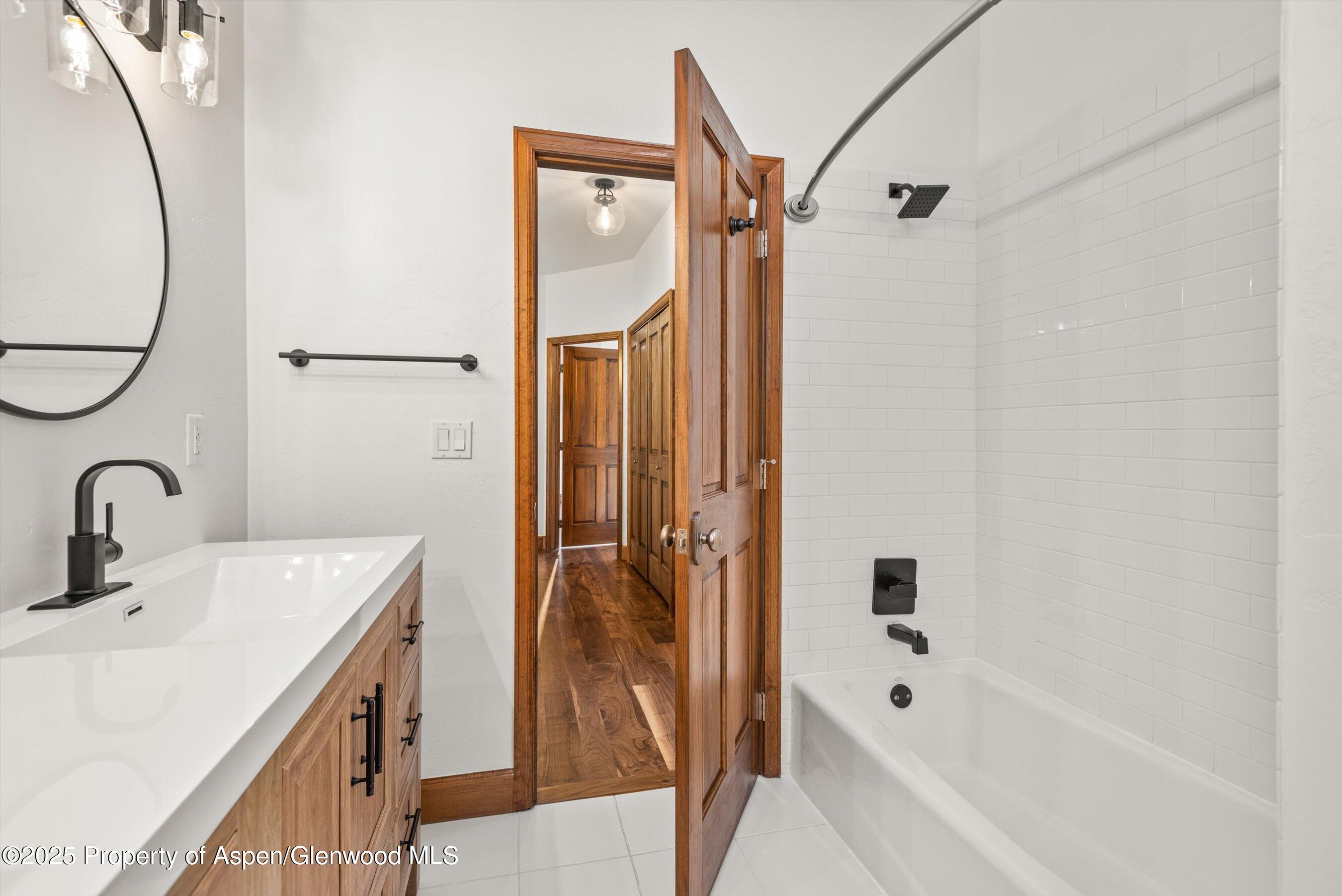 75 Buffalo Lane Carbondale, CO 81623 - Photo 39 of 49 a bathroom with a tub sink shower and mirror