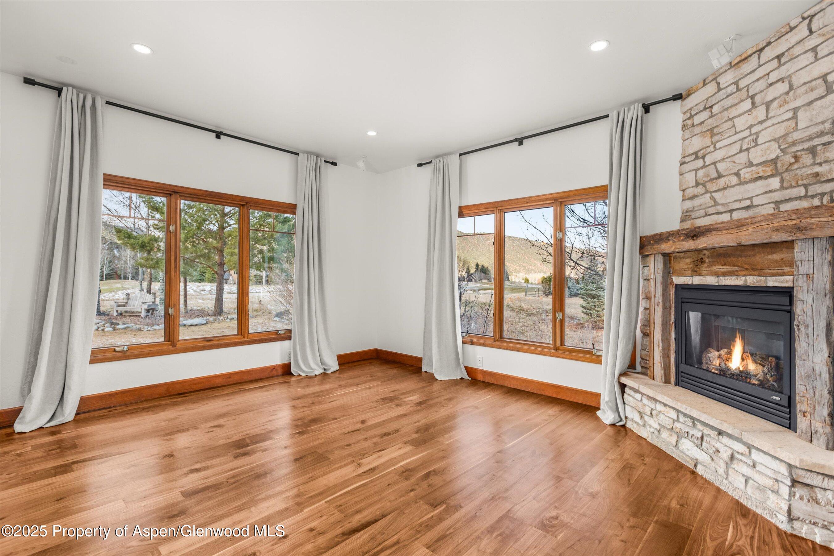 75 Buffalo Lane Carbondale, CO 81623 - Photo 8 of 49 a view of an empty room with a fireplace and a window