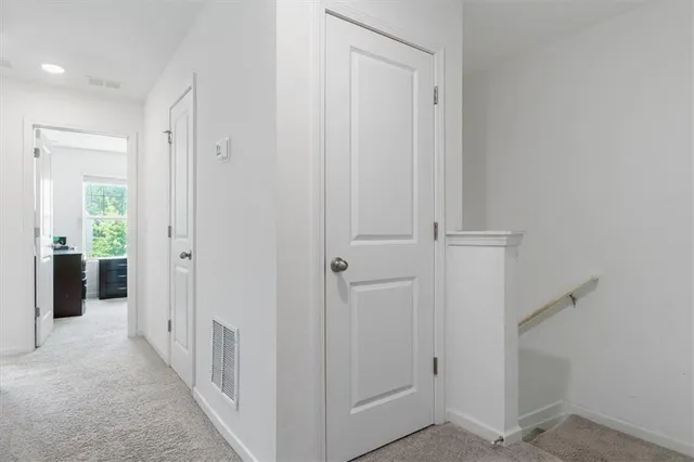 wooden floor with white walls