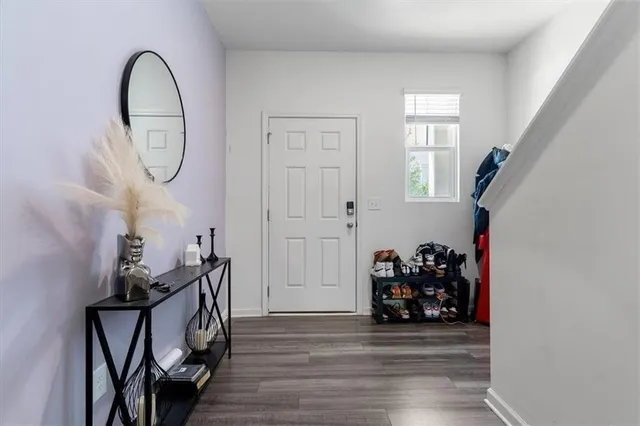 a view of a livingroom with furniture and hardwood floor