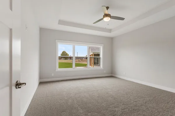 a view of an empty room with a window