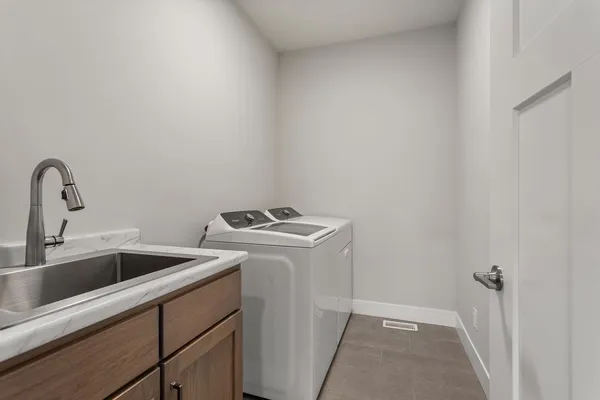 a view of storage and utility room with a sink