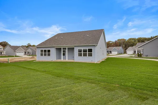 a view of a house with a backyard