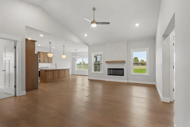 a view of a kitchen with a sink and a stove top oven