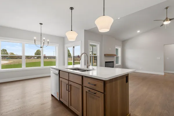 a kitchen with a sink and a large window