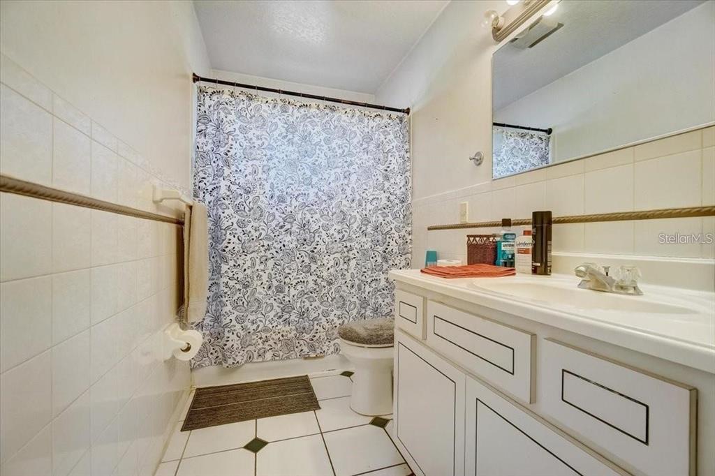 2950 Flounder Creek Road Mims, FL 32754 - Photo 14 of 29 a bathroom with a sink and a toilet
