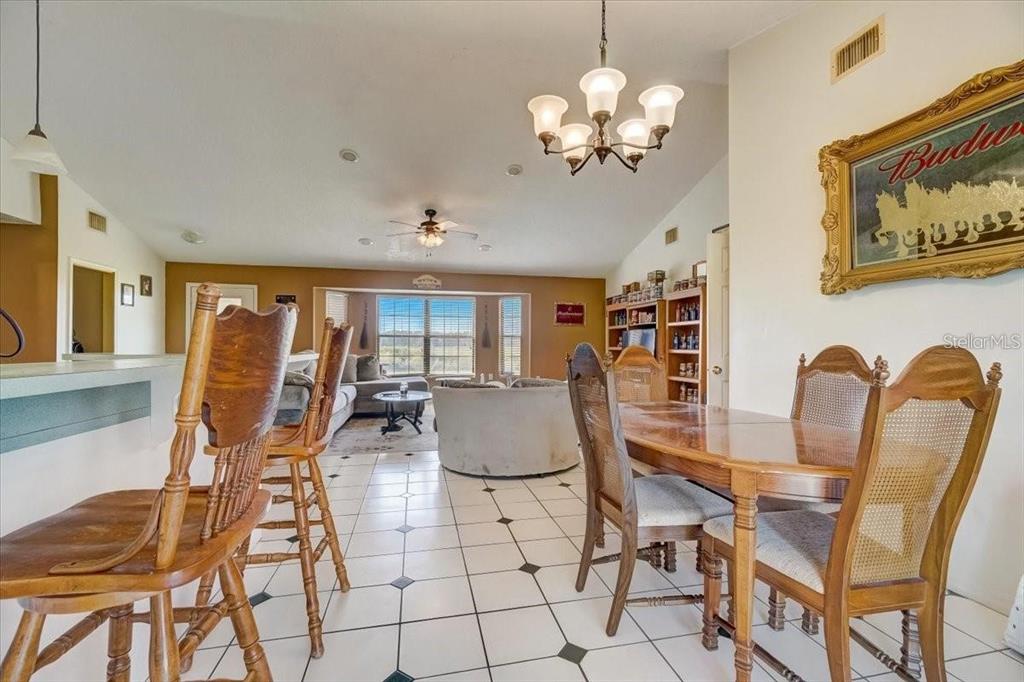 2950 Flounder Creek Road Mims, FL 32754 - Photo 7 of 29 a view of a dining room with furniture and chandelier