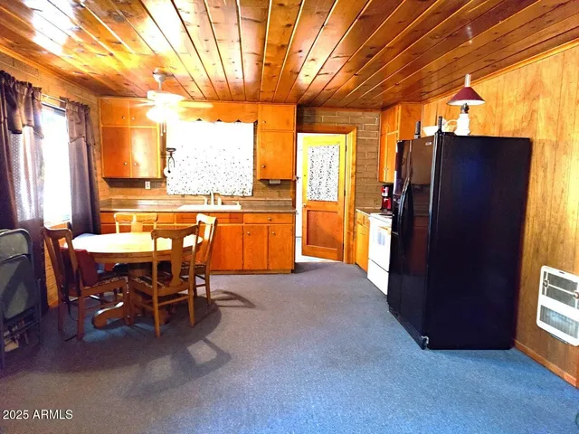 a view of a chairs and table in a patio