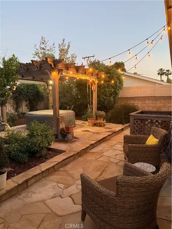 a view of a chairs and table in the patio
