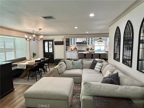 a living room with furniture fireplace and flat screen tv