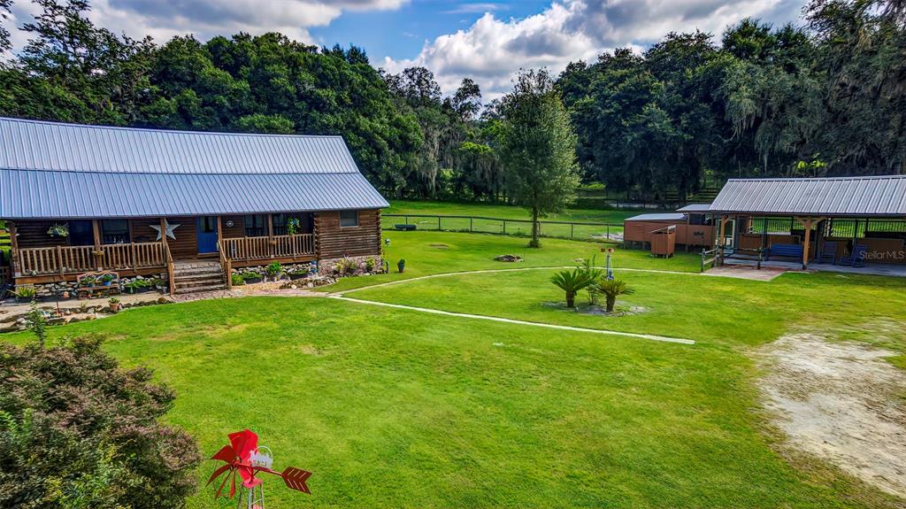 4292 Southwest 73rd Trail Bushnell, FL 33513 - Photo 60 of 85 a view of a house with a big yard and sitting area