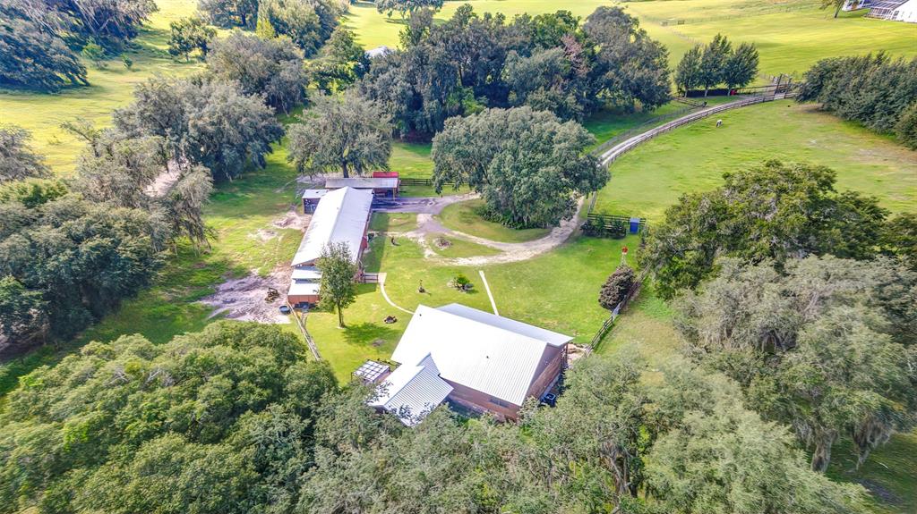 4292 Southwest 73rd Trail Bushnell, FL 33513 - Photo 67 of 85 a aerial view of a house with swimming pool and garden