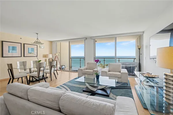 a living room with furniture dining table and a couch