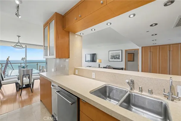 a kitchen with a sink and a refrigerator