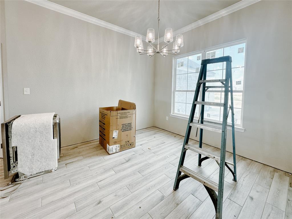1341 Promised Land Road Hewitt, TX 76643 - Photo 11 of 34 a room with furniture wooden floor and windows