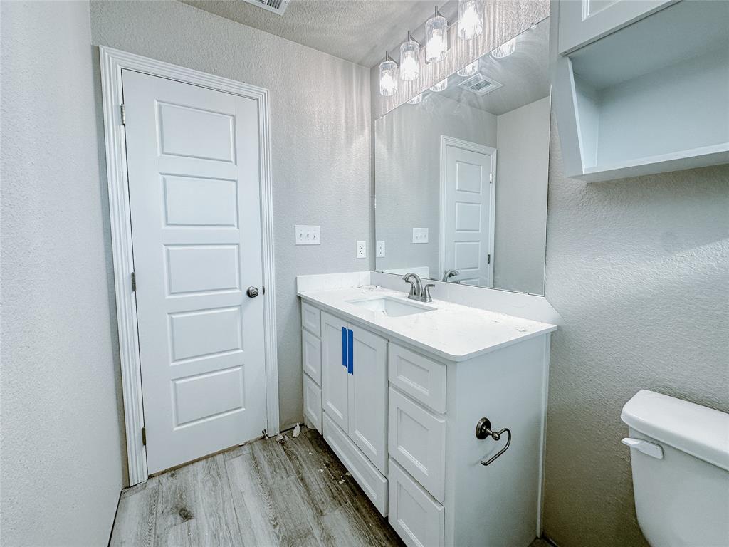 1341 Promised Land Road Hewitt, TX 76643 - Photo 14 of 34 a view of bathroom with a sink and mirror