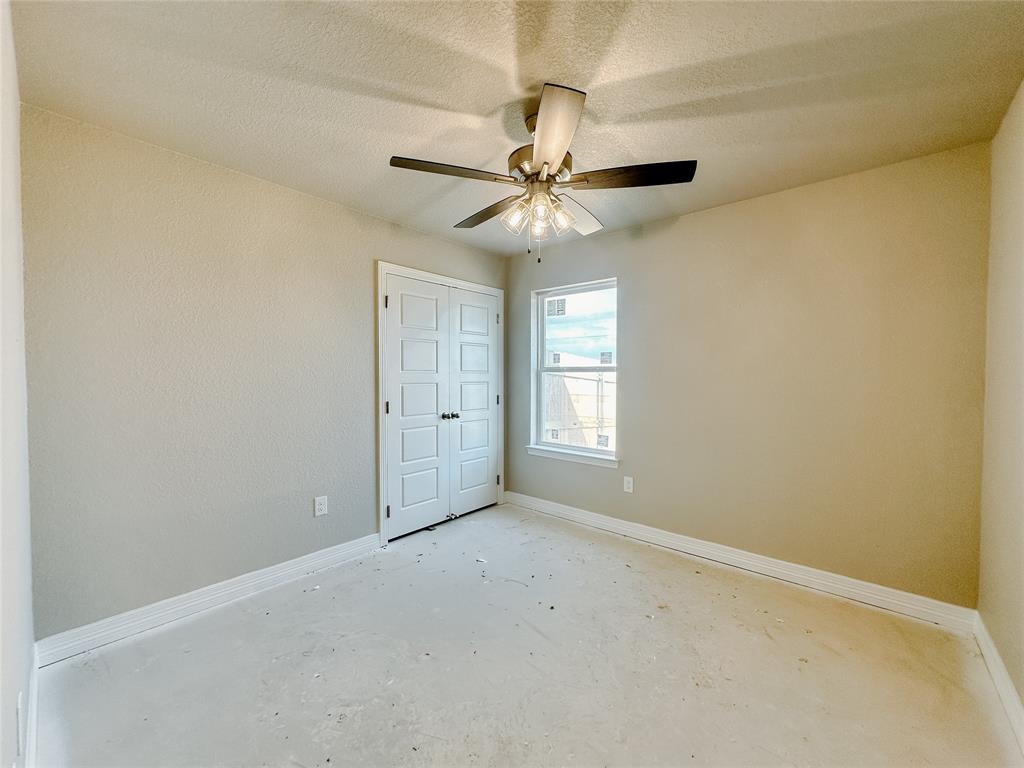 1341 Promised Land Road Hewitt, TX 76643 - Photo 20 of 34 an empty room with windows and fan