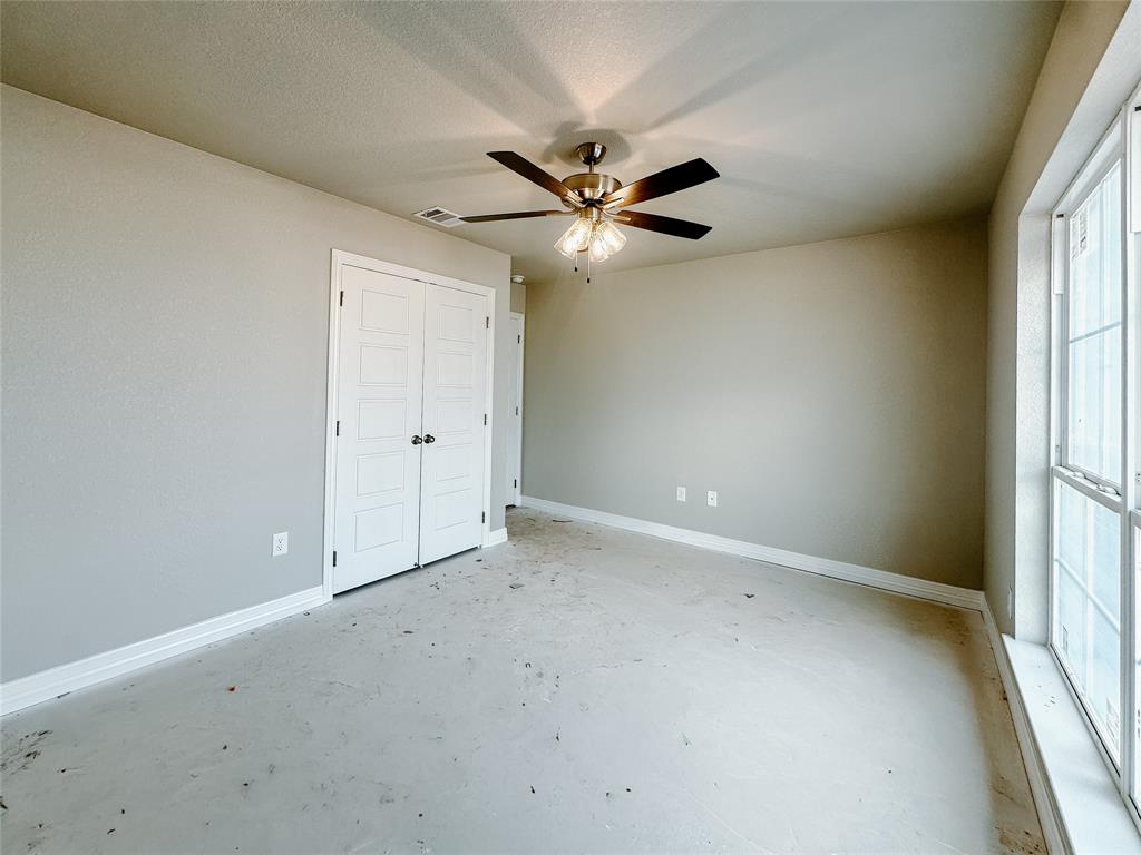 1341 Promised Land Road Hewitt, TX 76643 - Photo 28 of 34 an empty room with a window and a fan