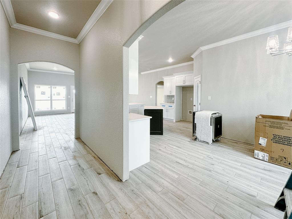 1341 Promised Land Road Hewitt, TX 76643 - Photo 3 of 34 a view of a kitchen with furniture and wooden floor