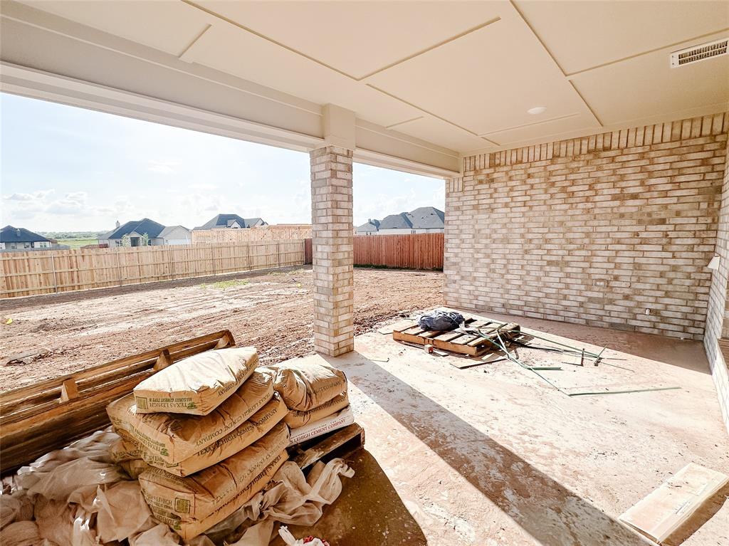 1341 Promised Land Road Hewitt, TX 76643 - Photo 32 of 34 a living room with couch wooden floor and a table