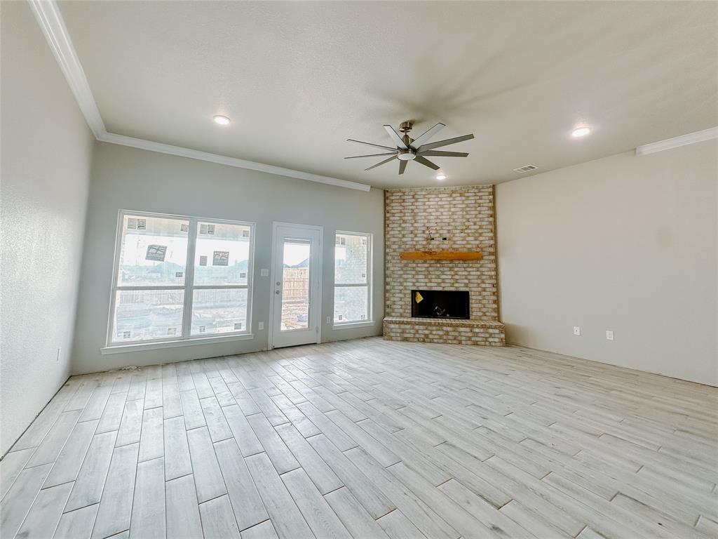 1341 Promised Land Road Hewitt, TX 76643 - Photo 5 of 34 a view of an empty room with a fireplace and a window