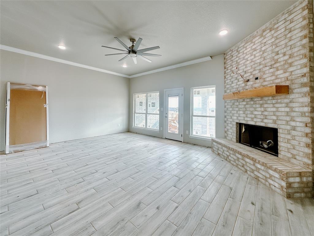 1341 Promised Land Road Hewitt, TX 76643 - Photo 7 of 34 a view of an empty room with a fireplace and a window