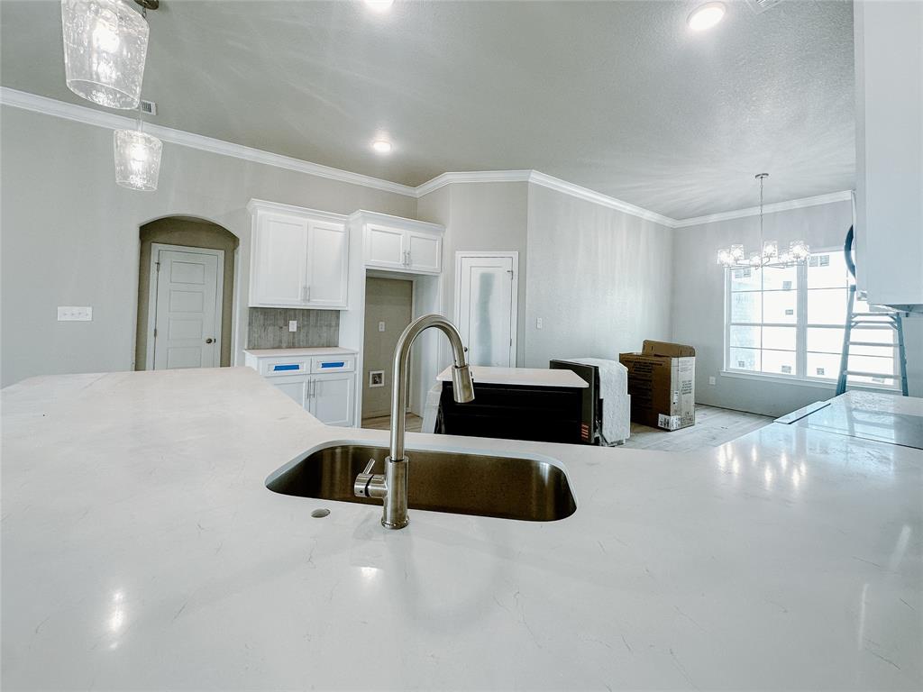 1341 Promised Land Road Hewitt, TX 76643 - Photo 8 of 34 a kitchen with stainless steel appliances a sink a microwave a refrigerator and window