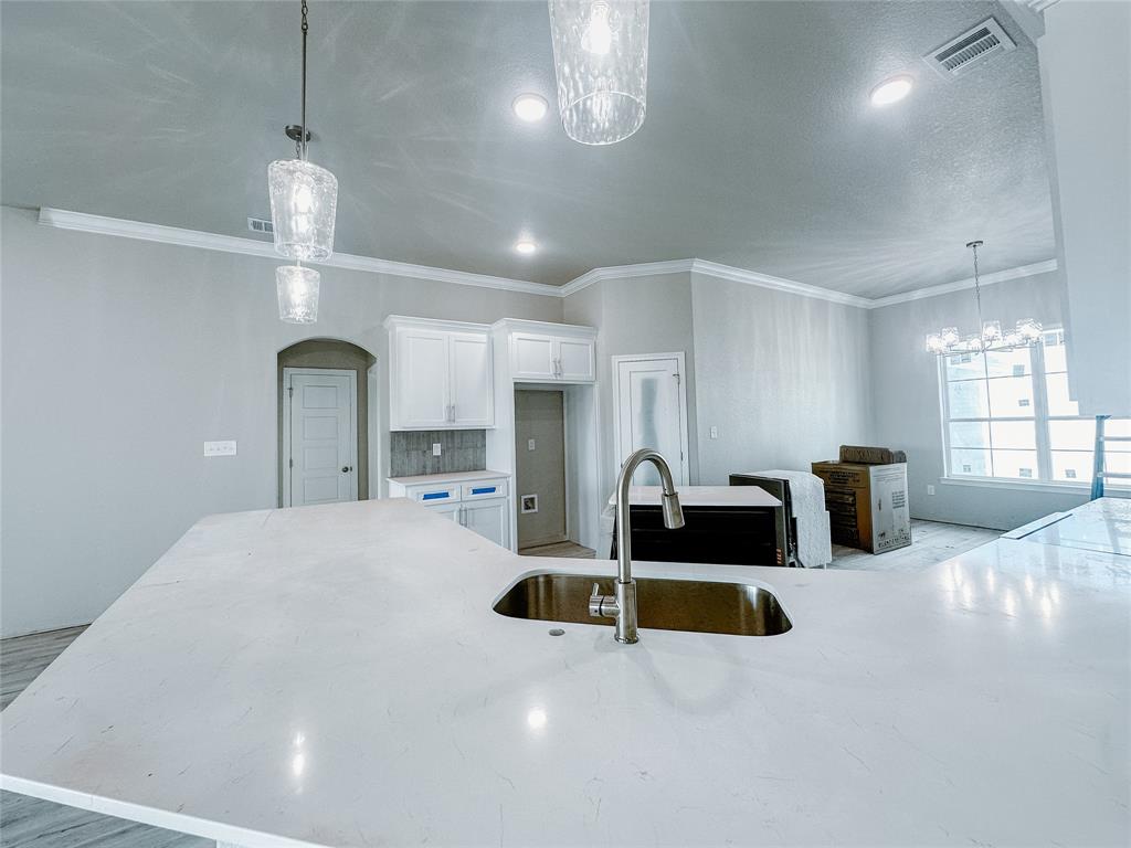 1341 Promised Land Road Hewitt, TX 76643 - Photo 9 of 34 a large kitchen with sink and a large window