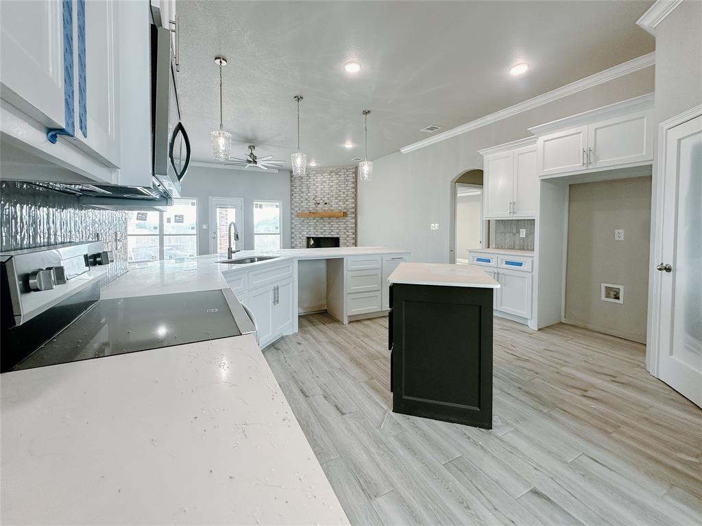1341 Promised Land Road Hewitt, TX 76643 - Photo 10 of 34 a large kitchen with stainless steel appliances lots of counter space and a sink