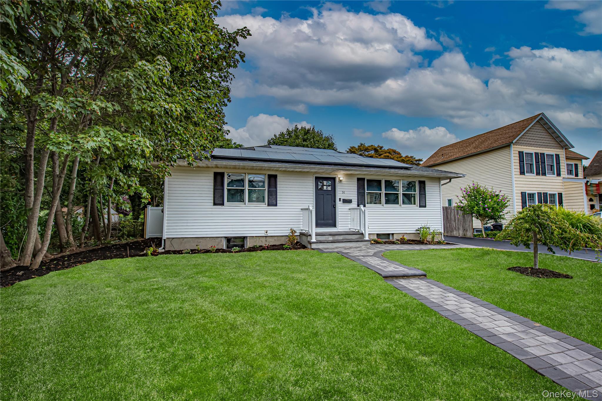 a view of a house with a backyard