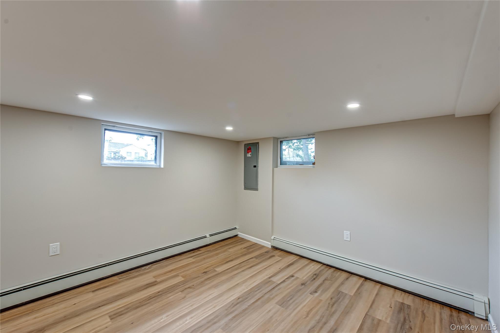 31 Terrell Street Patchogue, NY 11772 - Photo 13 of 21 a view of an empty room with wooden floor and a window