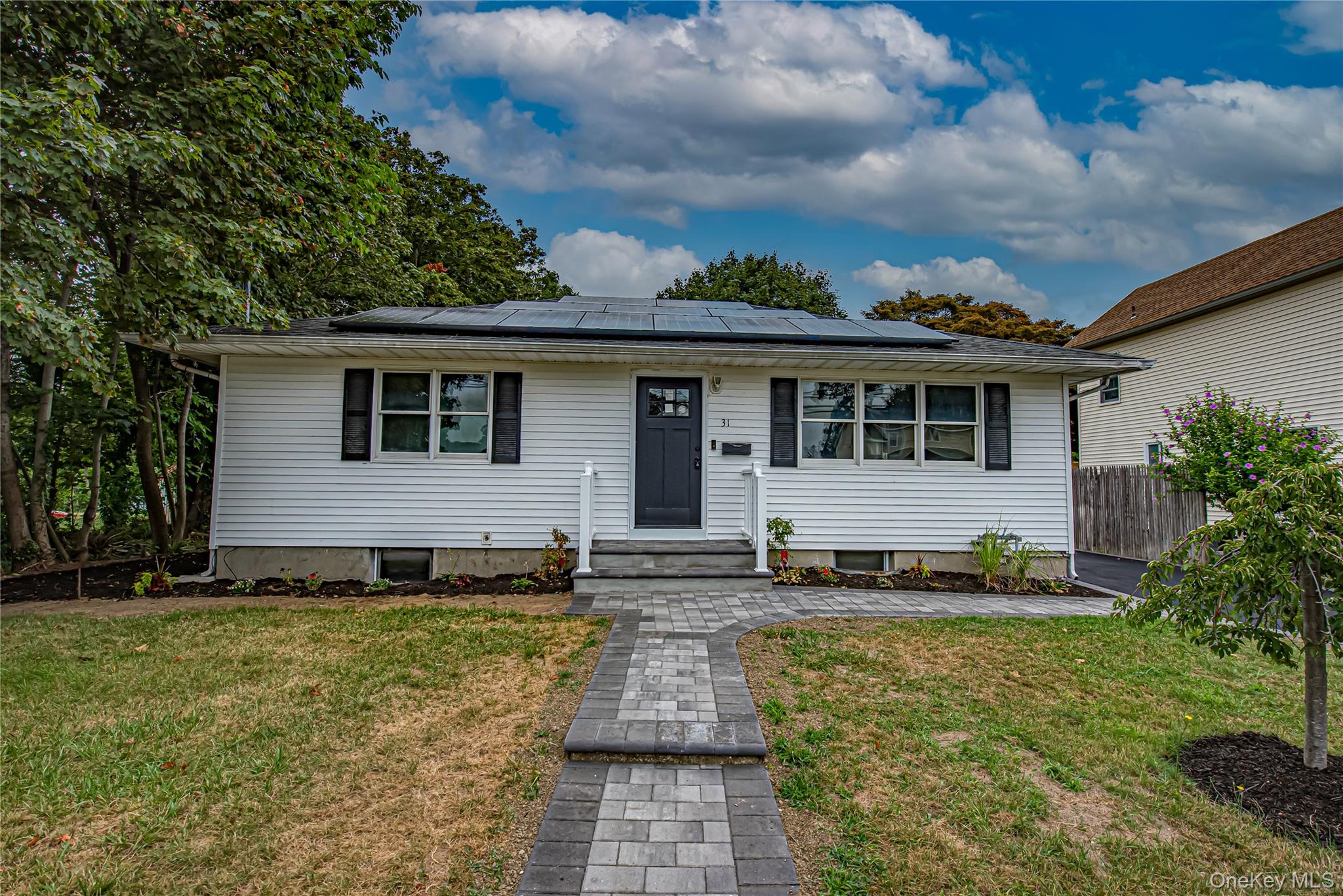 31 Terrell Street Patchogue, NY 11772 - Photo 19 of 21 a front view of a house with a yard
