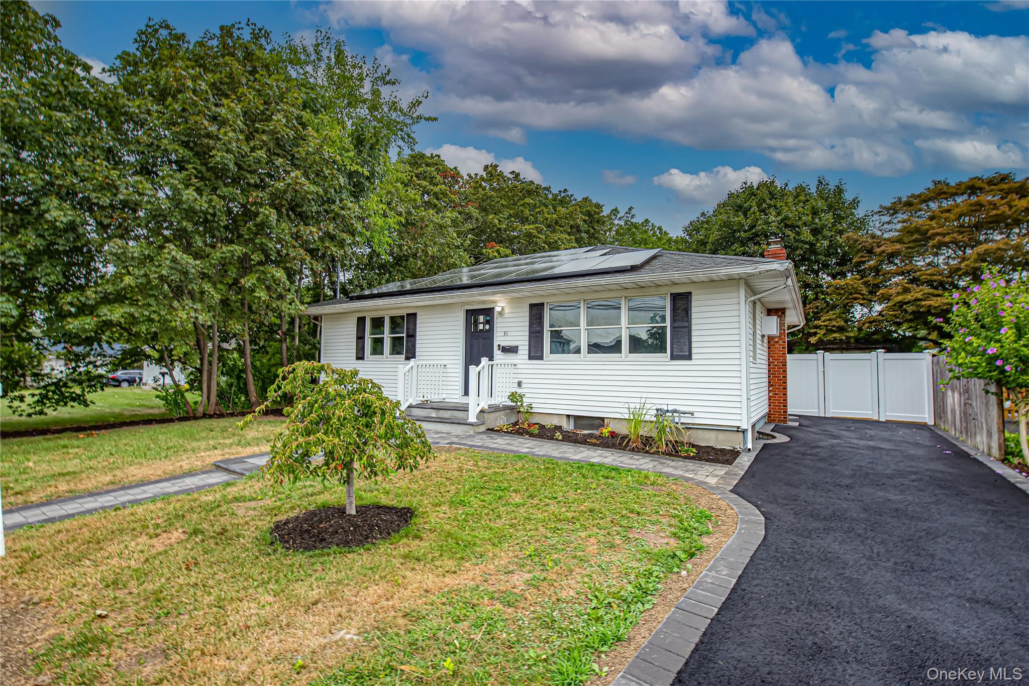 31 Terrell Street Patchogue, NY 11772 - Photo 20 of 21 a view of a house with backyard and sitting area