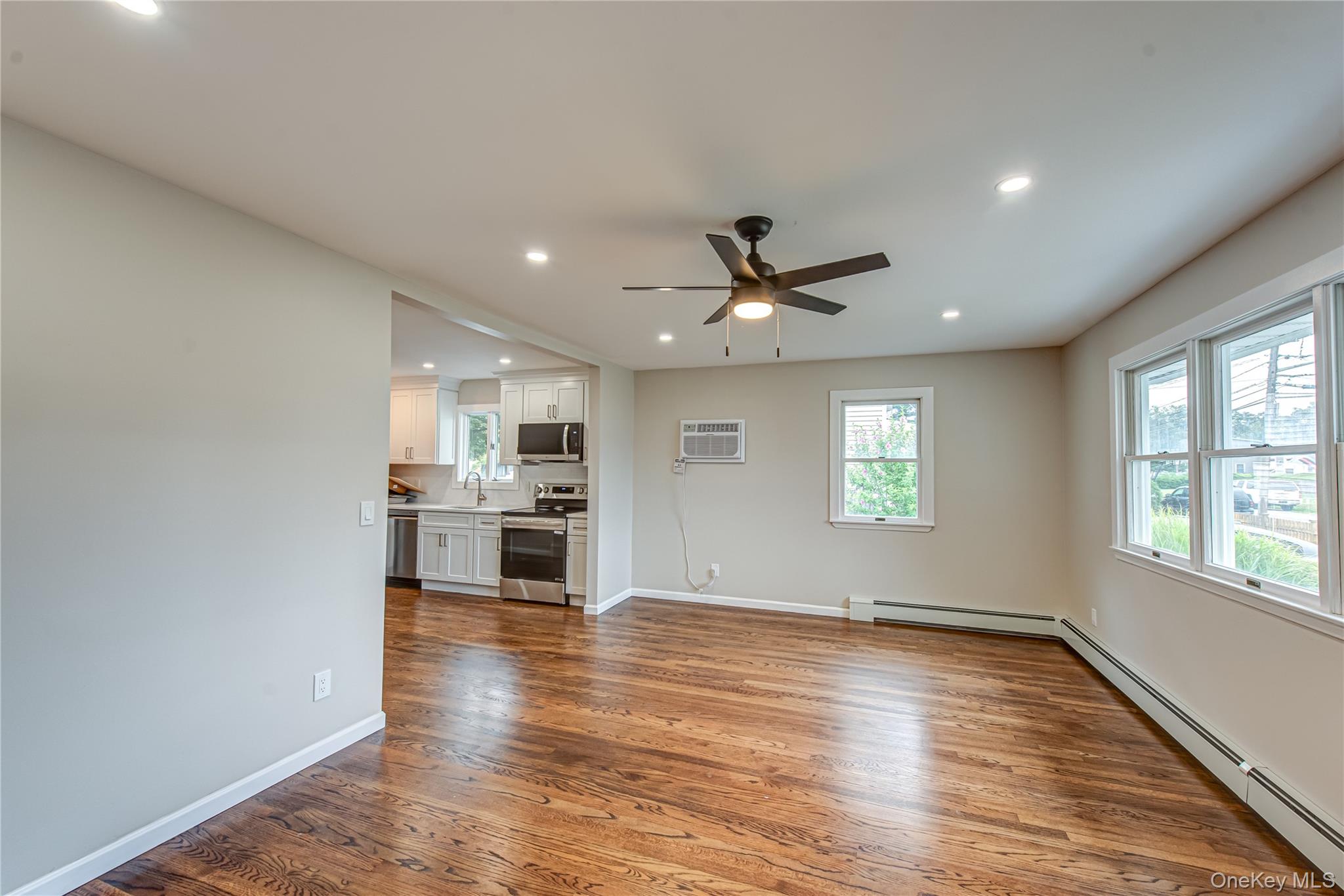 31 Terrell Street Patchogue, NY 11772 - Photo 2 of 21 a view of a kitchen with a sink dishwasher and a refrigerator