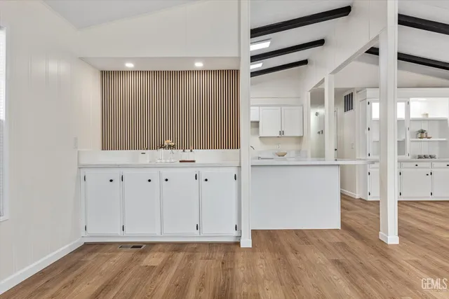 a view of cabinets with wooden floor