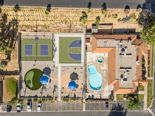 an aerial view of a house with a swimming pool