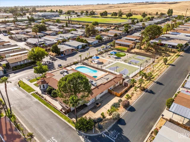 an aerial view of residential houses with outdoor space