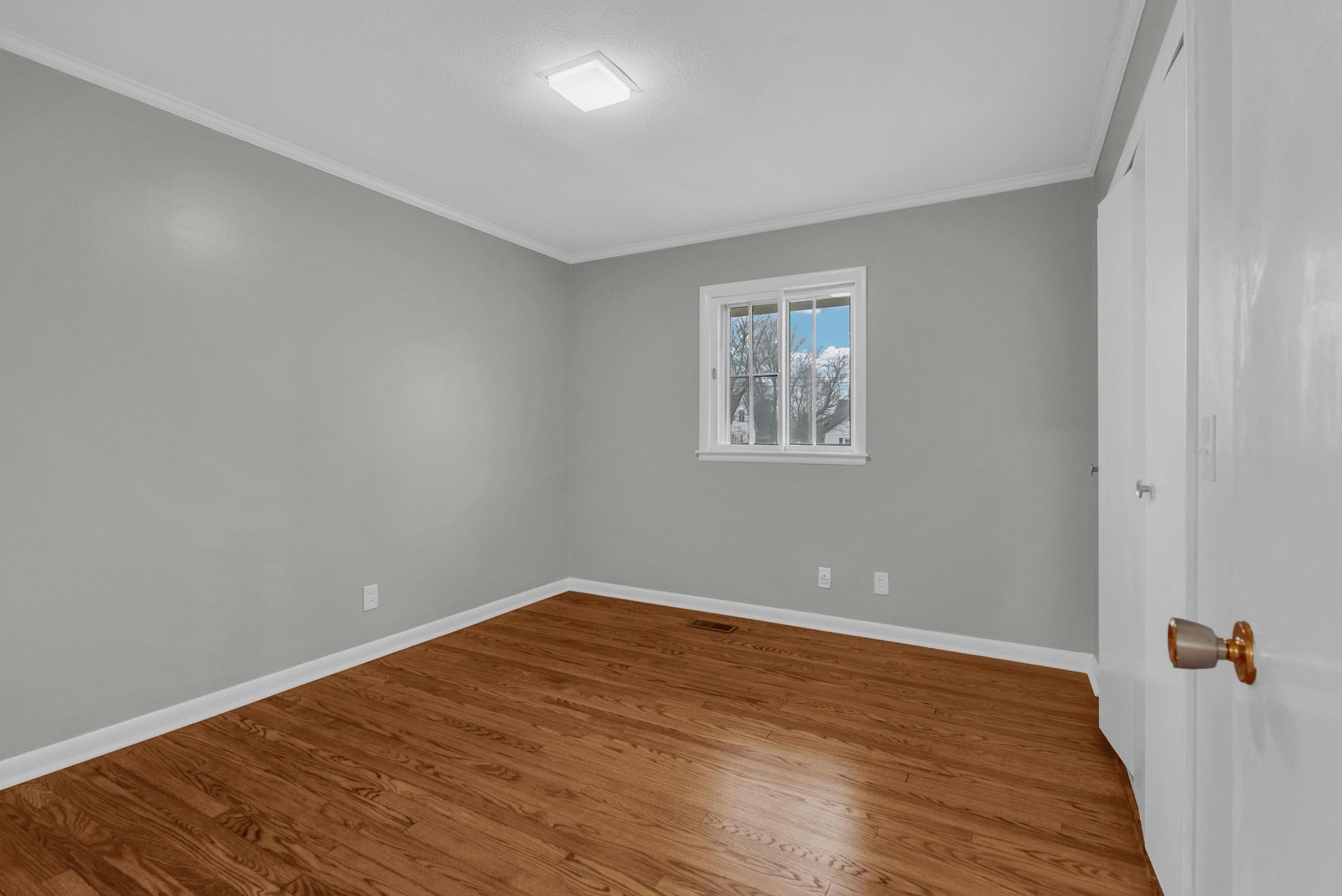 540 4th Avenue South Baxter, TN 38544 - Photo 13 of 26 wooden floor in an empty room with a window