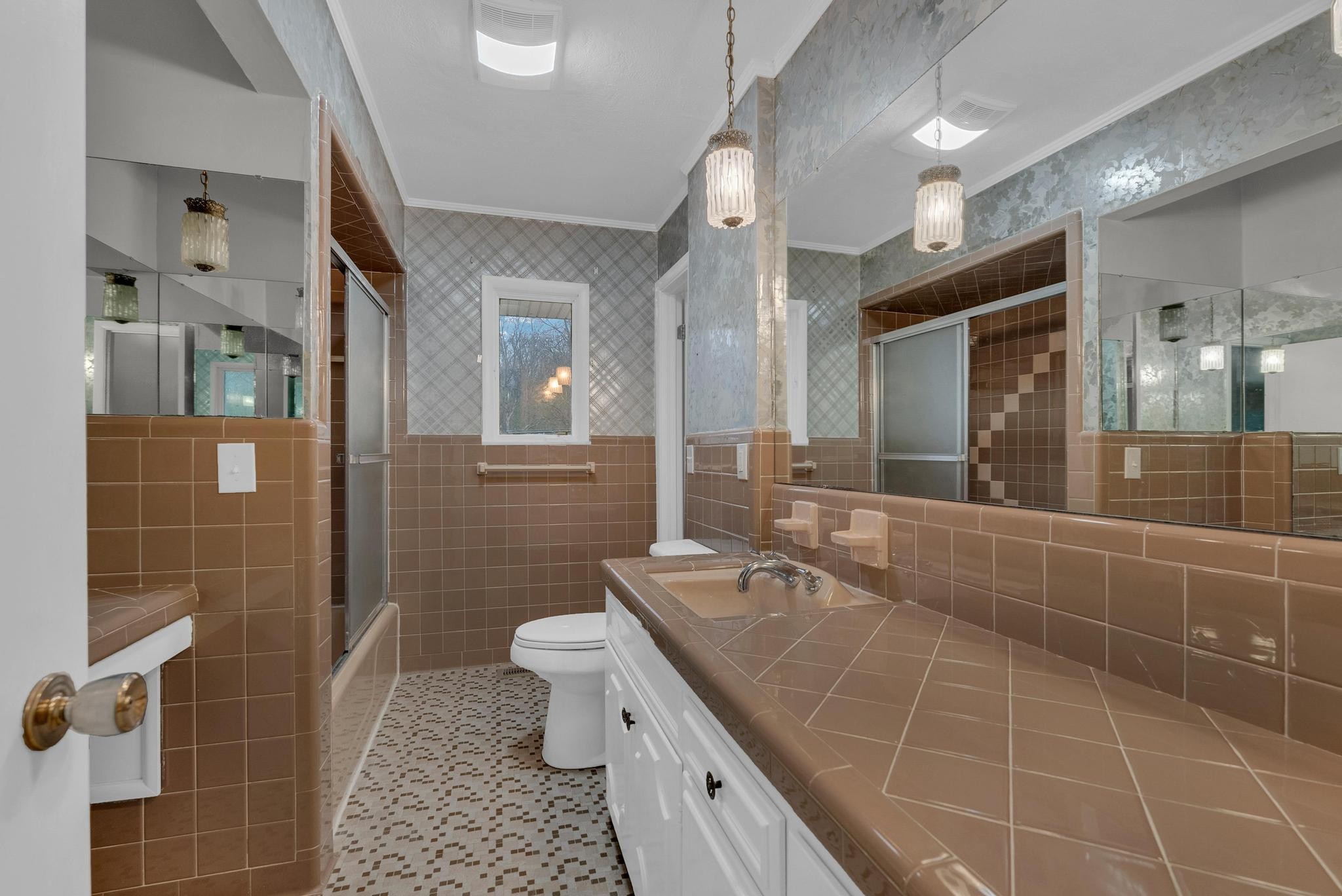 540 4th Avenue South Baxter, TN 38544 - Photo 15 of 26 a bathroom with a double vanity sink a toilet and a mirror