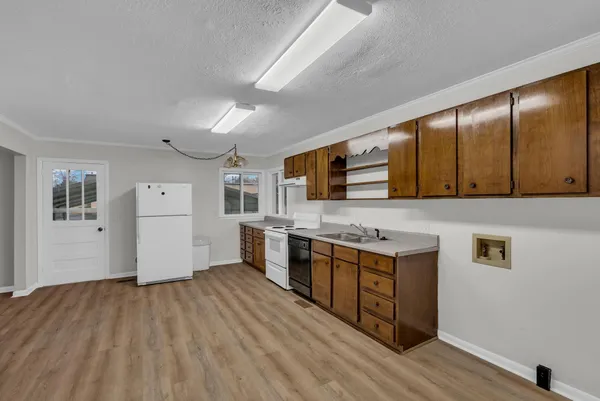 a kitchen with stainless steel appliances granite countertop a stove and a sink