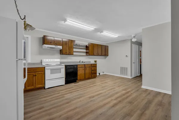 a kitchen with stainless steel appliances a stove top oven and sink