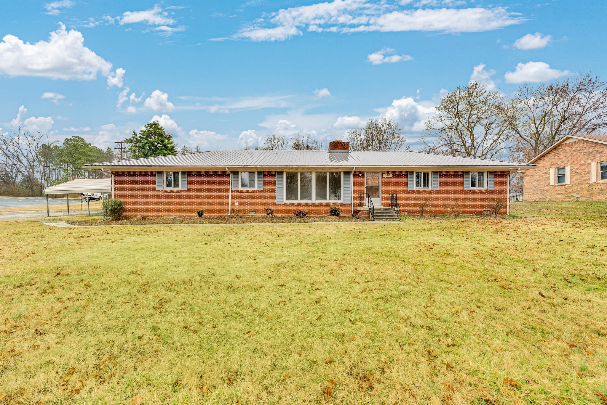 540 4th Avenue South Baxter, TN 38544 - Photo 2 of 26 a front view of house with yard and lake view